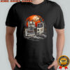 A cemetery of obsolete technology a floppy disk a cassette tape and a Game Boy shirt